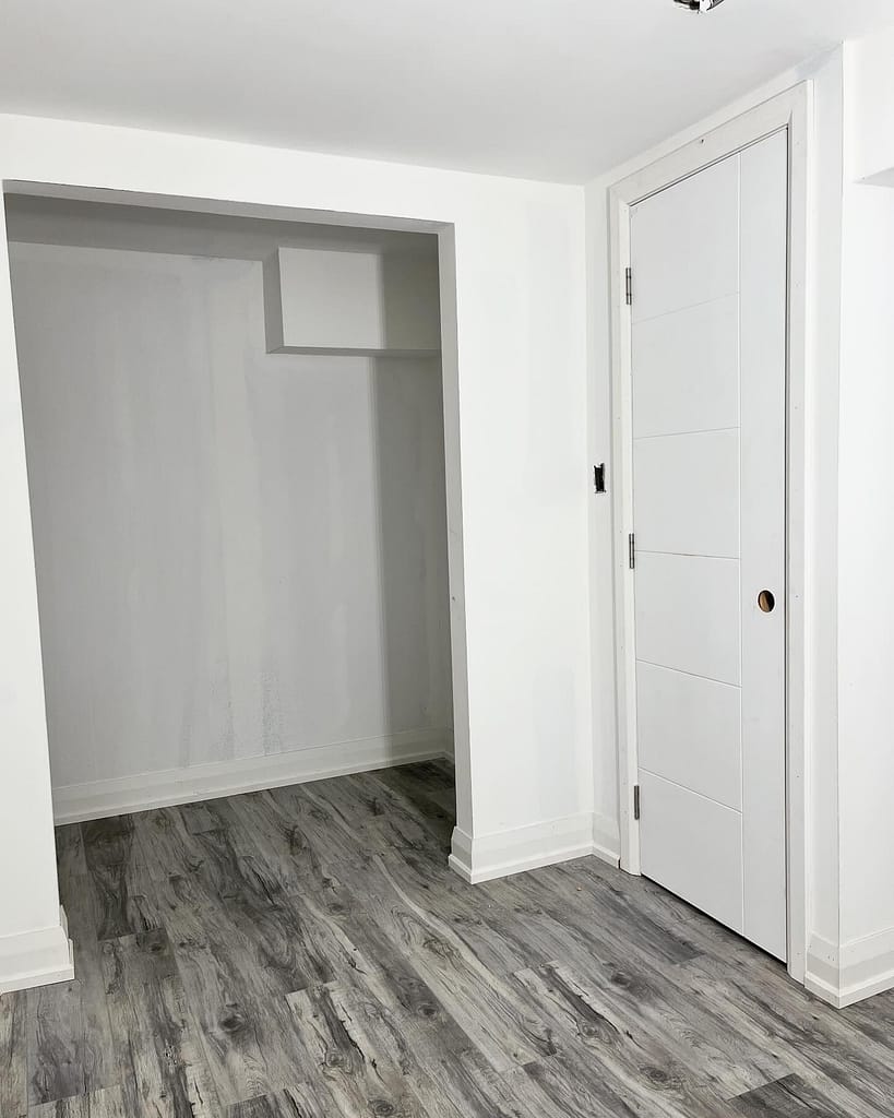 Finished Vaughan basement renovation with vinyl flooring, doors, casing and baseboards