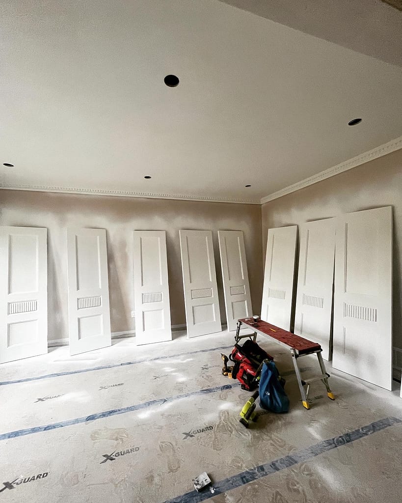 Primed solid interior doors ready for painter coordination in Vaughan