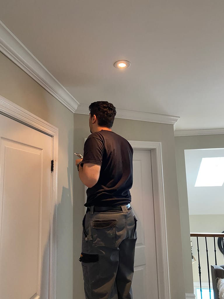 crown molding installation process by a finish carpenter at Wood Job Finish Carpentry in Oakville