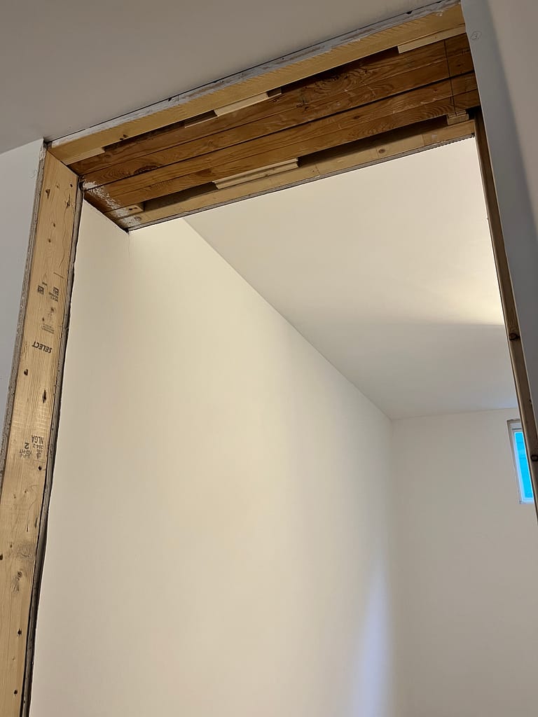 uneven door opening needs a customized door jambs from a finish carpenter at Wood Job Finish Carpentry in Milton basement renovation