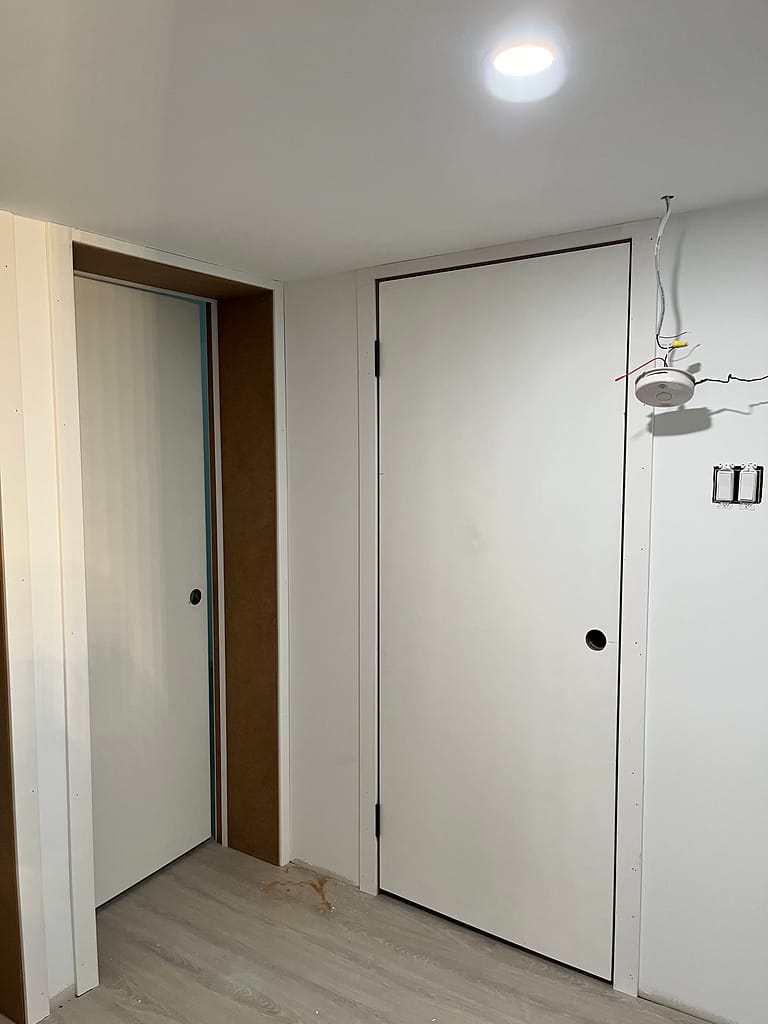 customized door jambs and resized door installed by a finish carpenter at Wood Job Finish Carpentry in Milton basement renovation