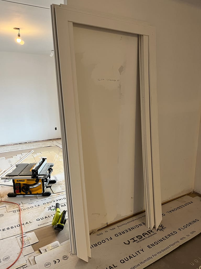 mitered door casings prepared for installation by a finish carpenter at Wood Job Finish Carpentry in a Toronto bungalow renovation