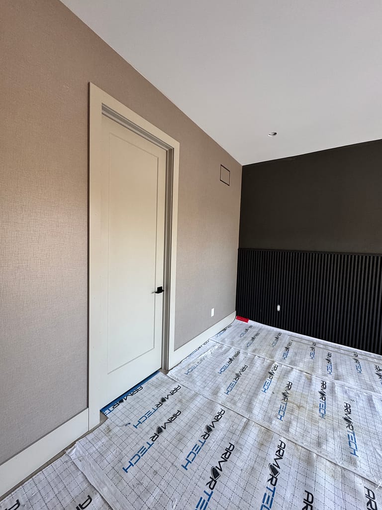 interior solid doors and baseboards installed by a finish carpenter at Wood Job Finish Carpentry in a Cambridge custom home