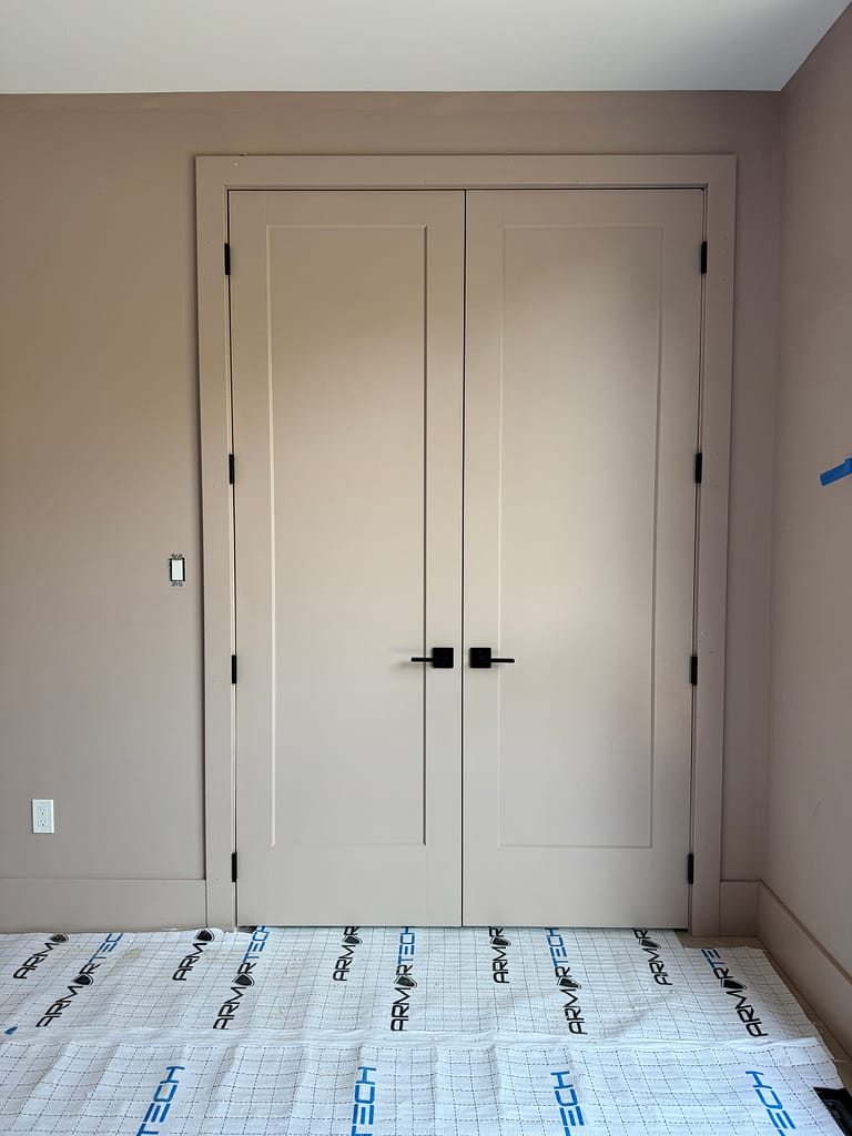 interior solid doors, trims, and baseboards installed by a finish carpenter at Wood Job Finish Carpentry in a Cambridge custom home
