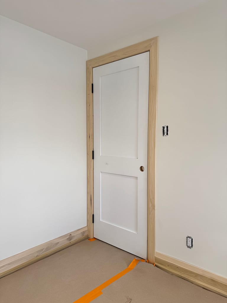 a door and trim installed by a finish carpenter at Wood Job Finish Carpentry in a Milton home