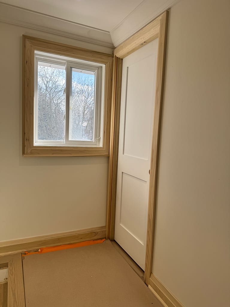 a door and trim installed by a finish carpenter at Wood Job Finish Carpentry in a Milton home