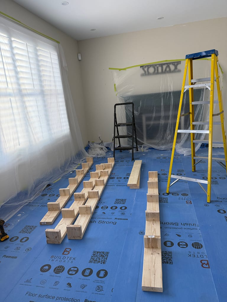 the structural beam preparation for a coffered ceiling installation by a finish carpenter in a Guelph house