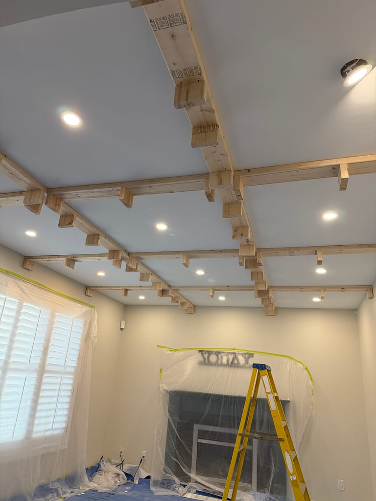 the structural beam preparation for a coffered ceiling installation by a finish carpenter in a Guelph house