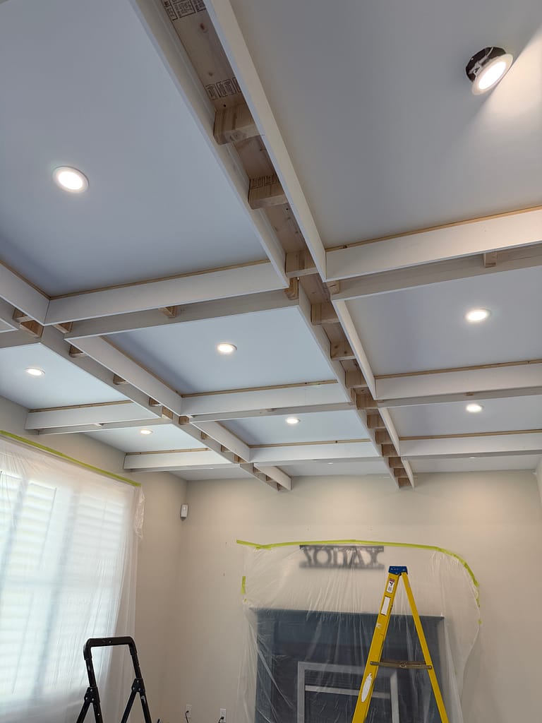 the beam preparation for a coffered ceiling installation by a finish carpenter in a Guelph house