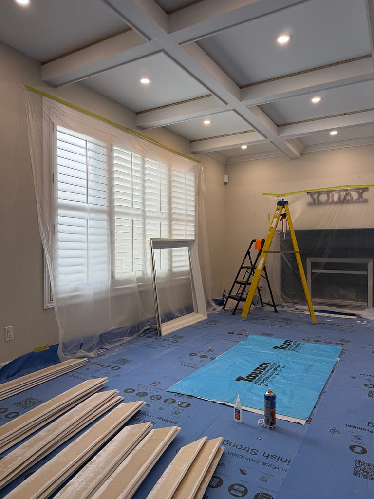 the crown molding preparation for a coffered ceiling installation by a finish carpenter in a Guelph house