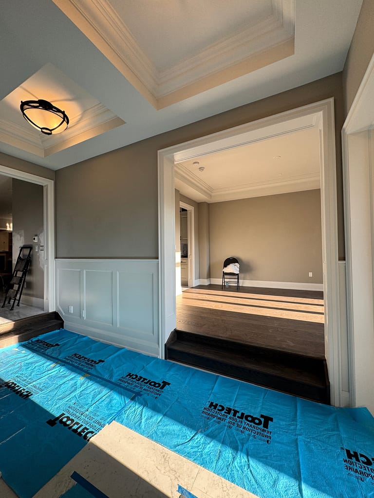 Archway moulding and wainscotting panels in Burlington foyer