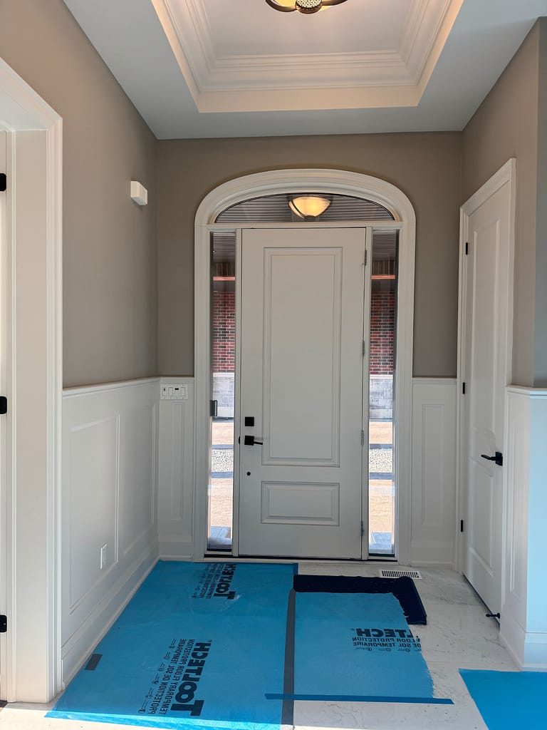Custom foyer accent wall paneling completed for Burlington homeowners