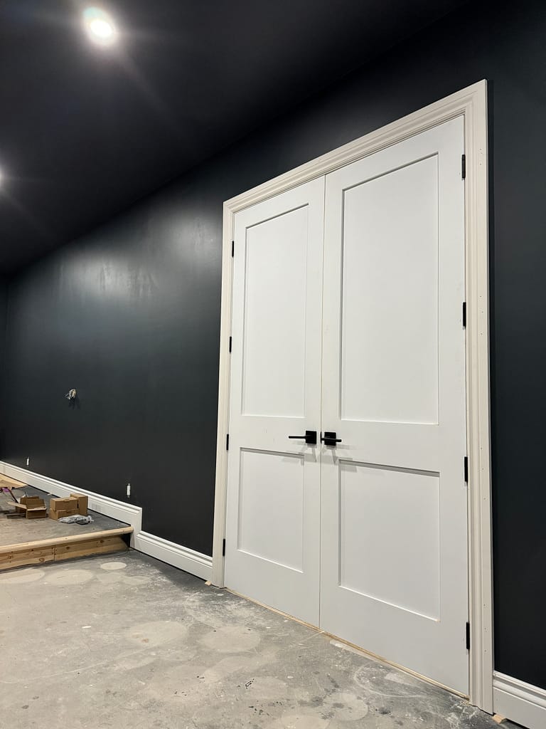 Completed basement interior door and casing by a finish carpenter in Oakville home