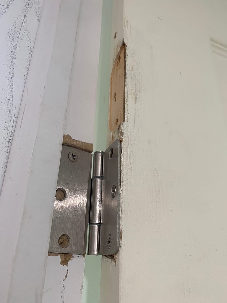 Incorrect hinge mortise before door repair in Kitchener home