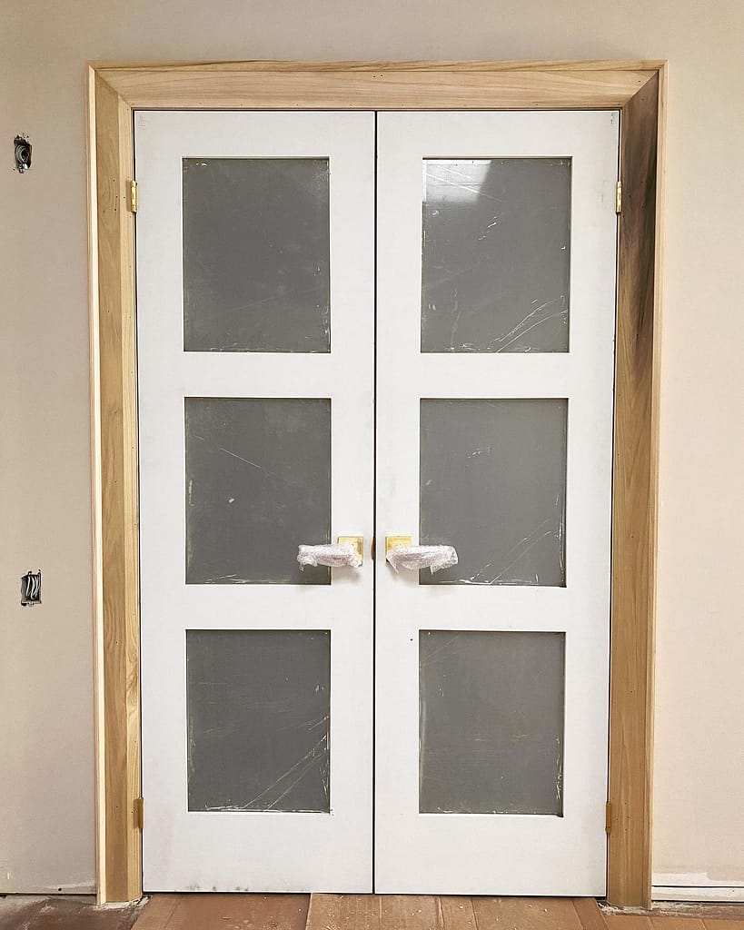 solid French glass doors, trim, and baseboards installed by a finish carpenter at Wood Job Finish Carpentry in a Toronto house