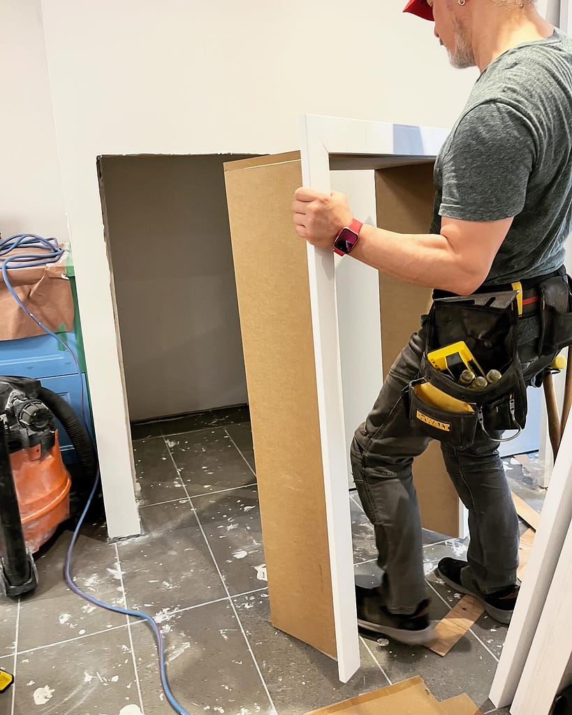 the finish carpenter working on a custom door jamb installation in Mississauga