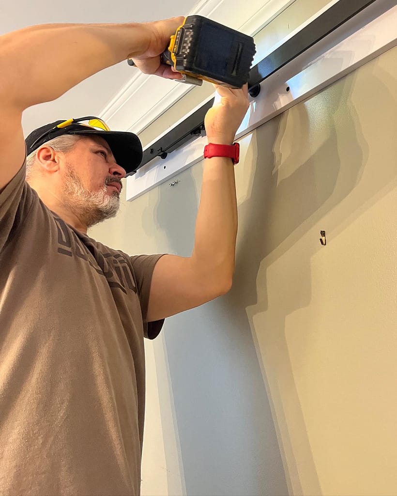 the finish carpenter working on a bard door installation in Mississauga
